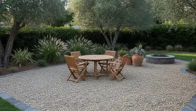 Professionally installed pea gravel patio with furniture in Sacramento, CA by Chop Chop Landscaping